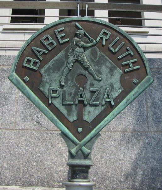 Bronze sports memorial plaque honoring Babe Ruth, displayed in a public plaza with detailed engraving and historical significance.
